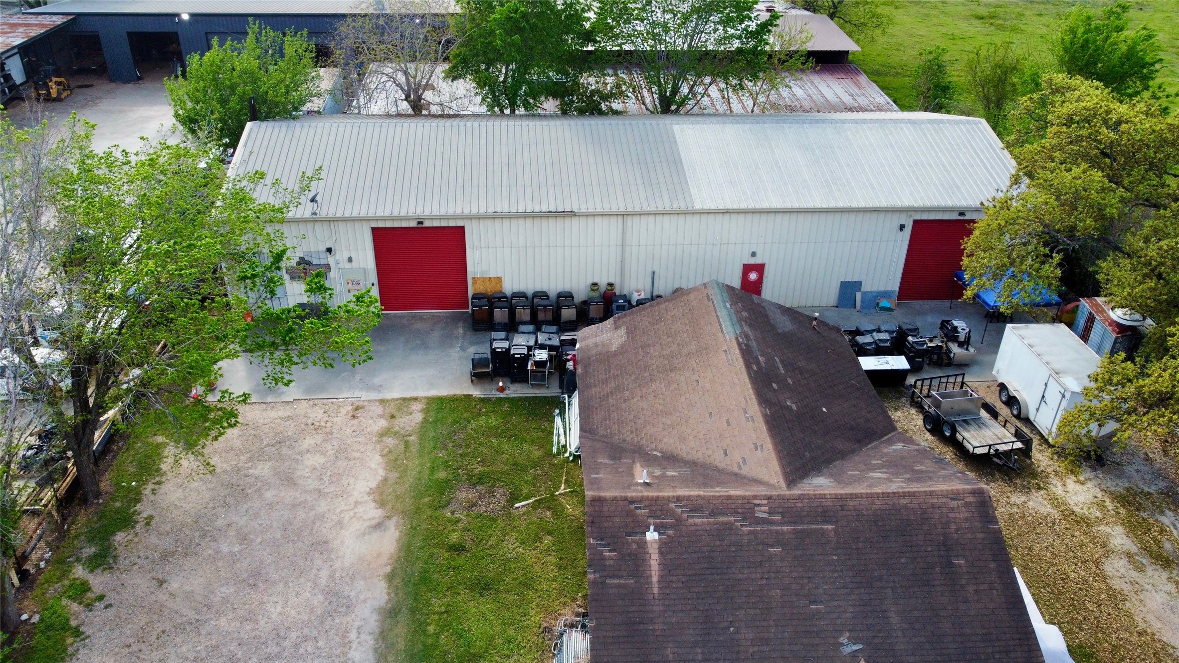 6951 Windfern Road Houston, TX 77040 - Photo 4 of 8 an aerial view of a house with a yard and sitting area