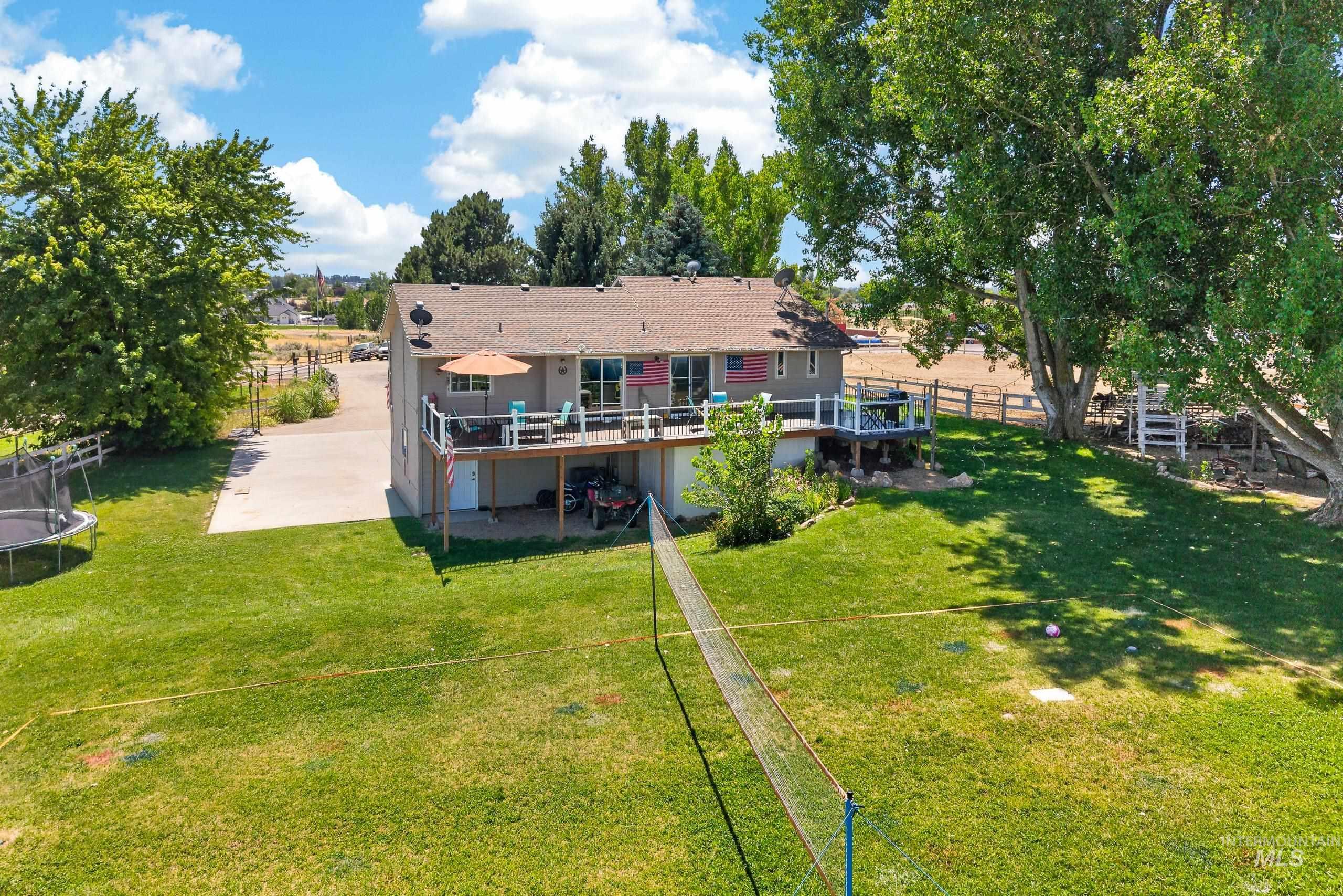 9696 Gloria Road Middleton, ID 83644 - Photo 44 of 50 Spacious rear yard with expansive lawn and mature shade trees