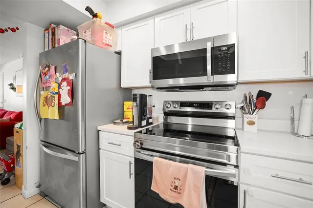 a bathroom with a sink vanity mirror and toilet