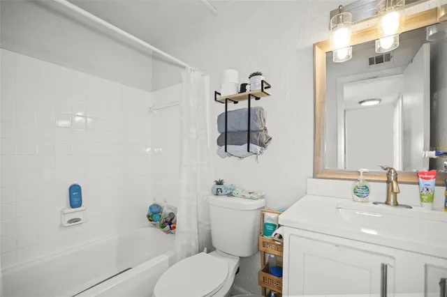 a room with a bed and a view of painting