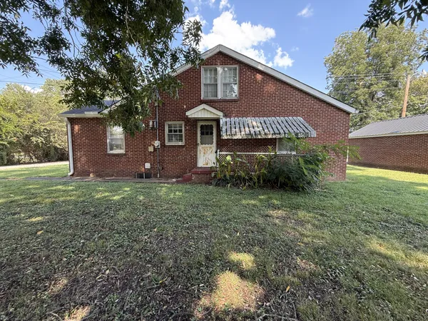 a front view of house with garden