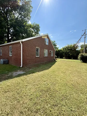 a view of backyard with green space