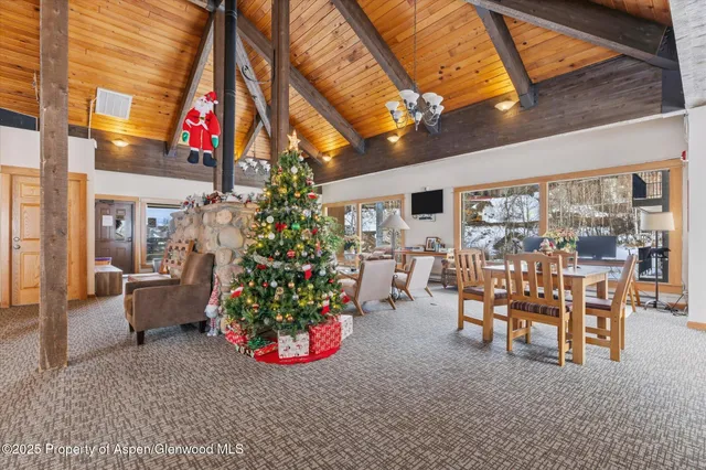 a swimming pool view with a seating space