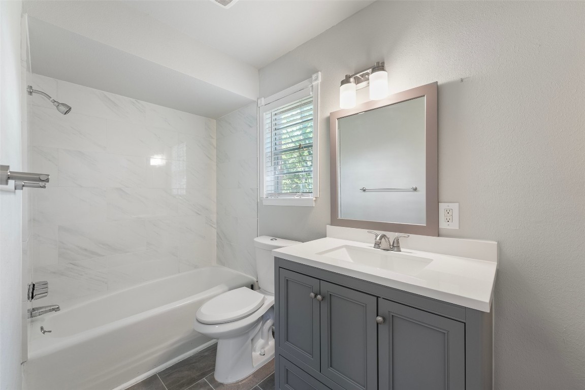 5907 Peg Street Houston, TX 77092 - Photo 11 of 21 a bathroom with a sink a toilet and shower