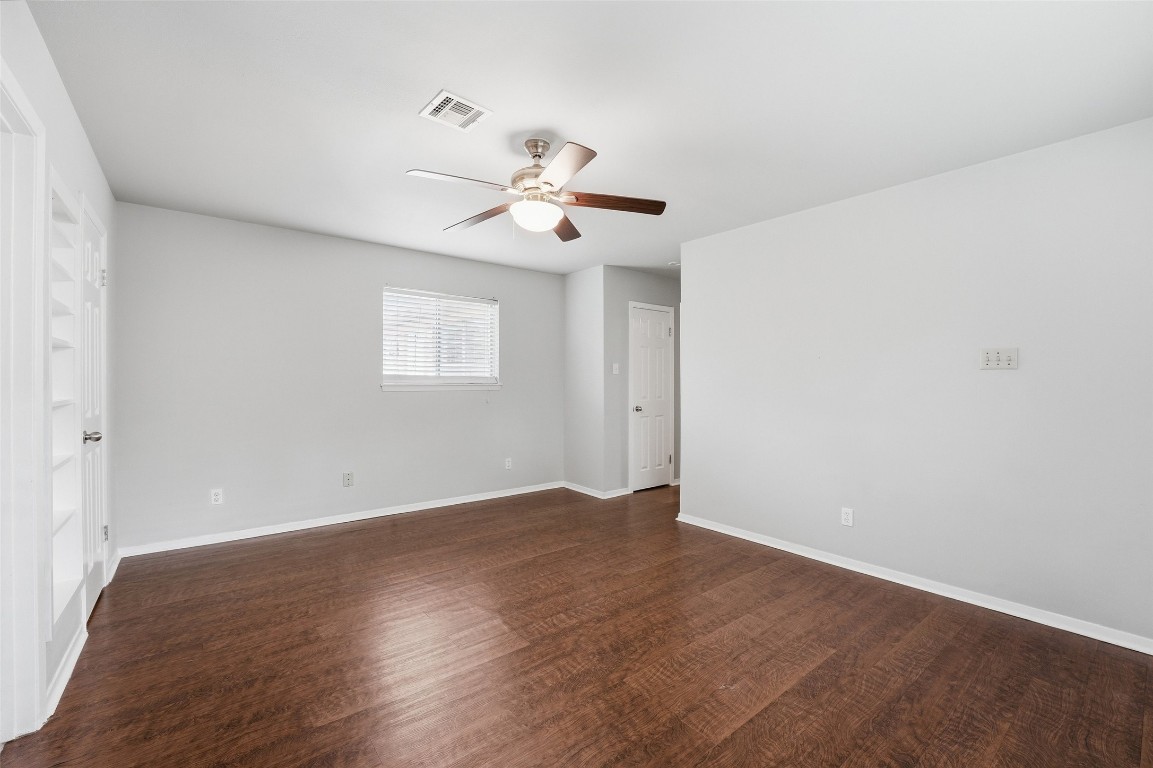 5907 Peg Street Houston, TX 77092 - Photo 13 of 21 wooden floor in an empty room with a window