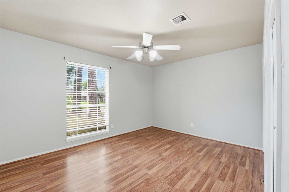 5907 Peg Street Houston, TX 77092 - Photo 15 of 21 wooden floor in an empty room with a window