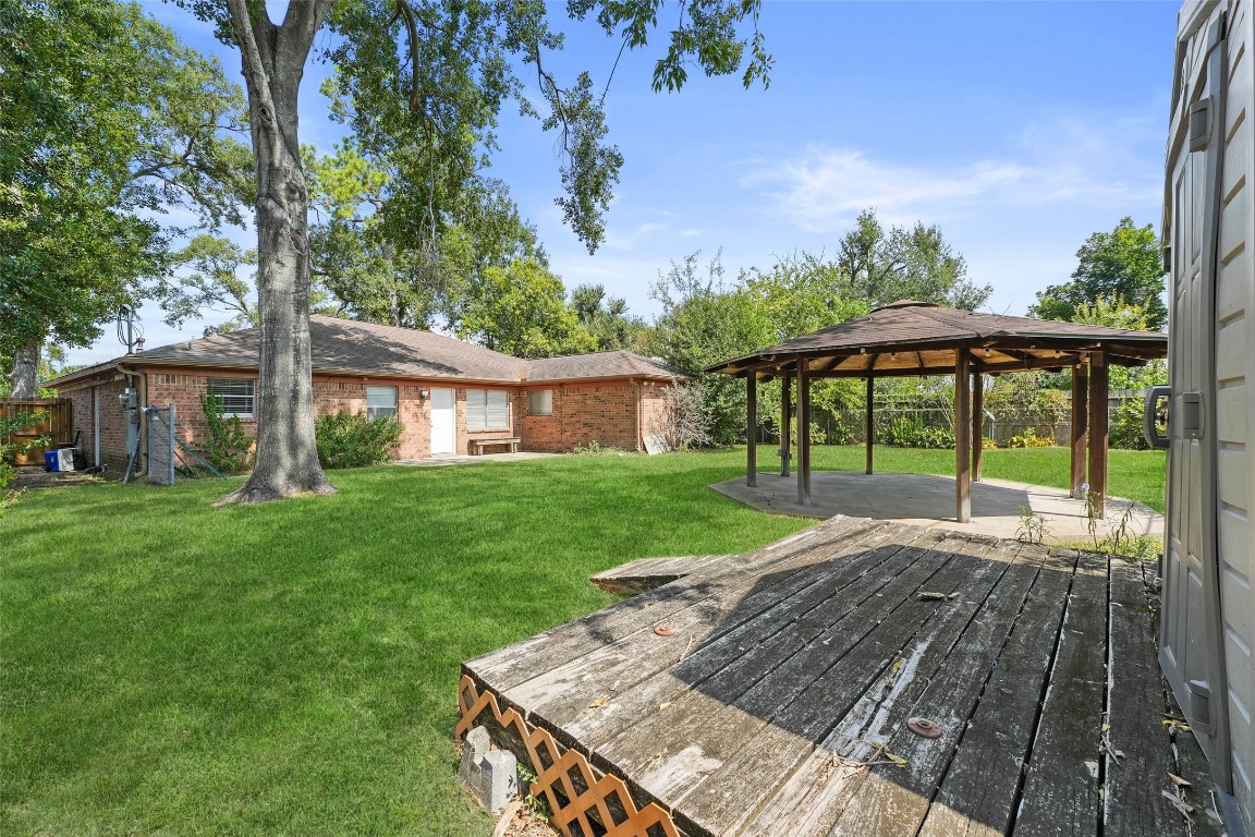 5907 Peg Street Houston, TX 77092 - Photo 20 of 21 a view of a house with a yard