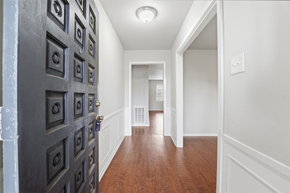 5907 Peg Street Houston, TX 77092 - Photo 2 of 21 a hallway with wooden floor
