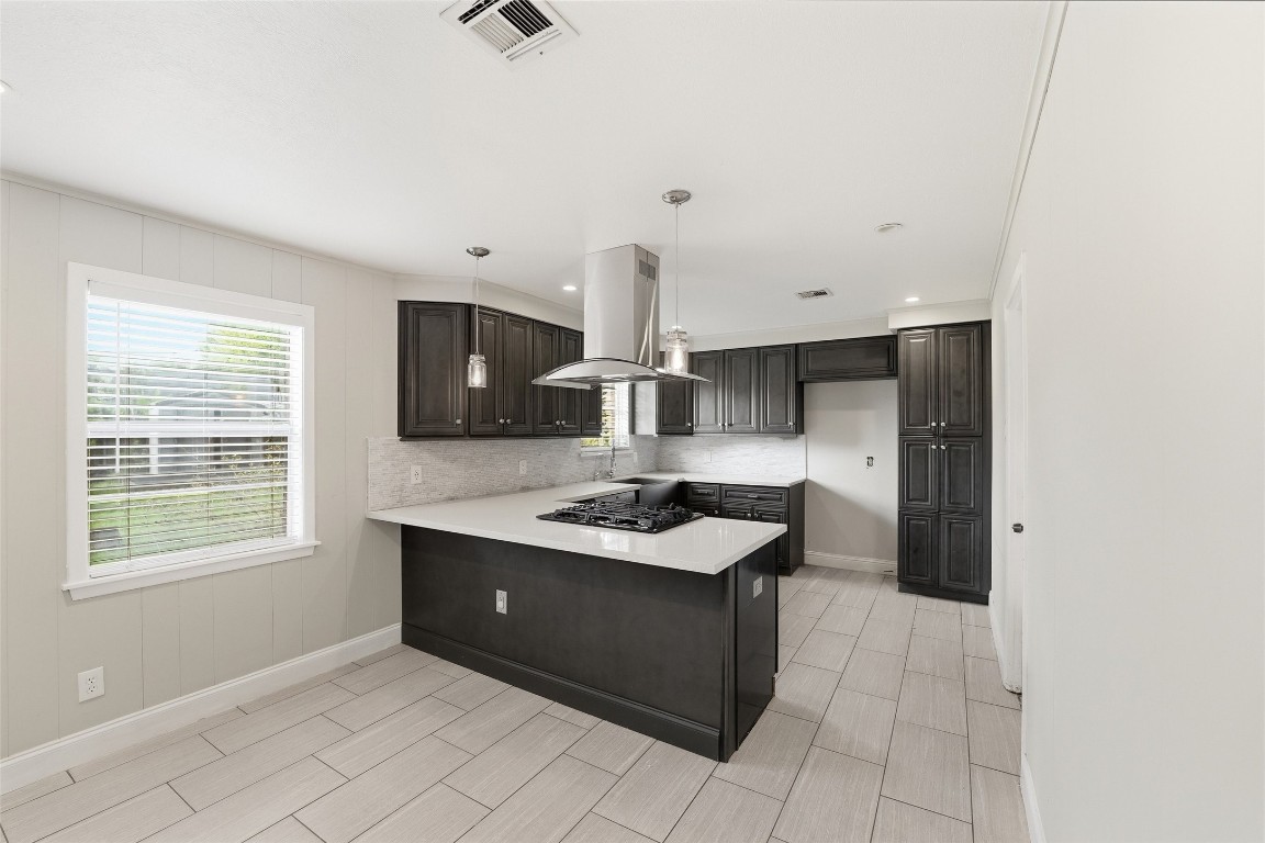 5907 Peg Street Houston, TX 77092 - Photo 7 of 21 a kitchen with stainless steel appliances a sink stove and cabinets