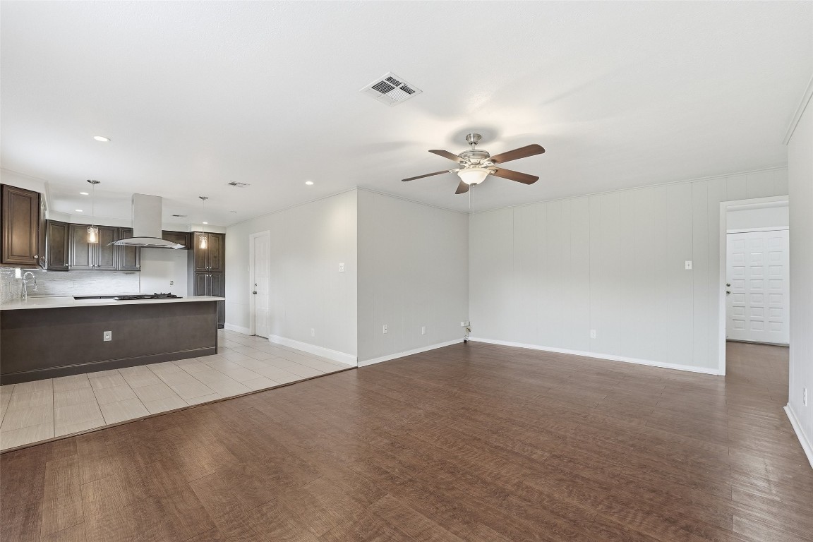 5907 Peg Street Houston, TX 77092 - Photo 9 of 21 a view of kitchen with granite countertop cabinets and refrigerator