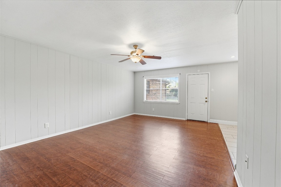5907 Peg Street Houston, TX 77092 - Photo 10 of 21 wooden floor in an empty room with a window