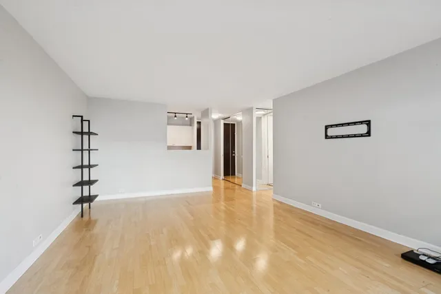 a view of an empty room with a window