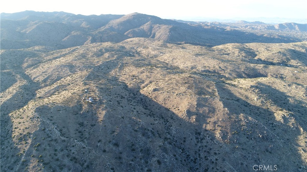 2-ac Burns Canyon Road Pioneertown, CA 92268 - Photo 11 of 14 a view of a dry yard with mountains in the background