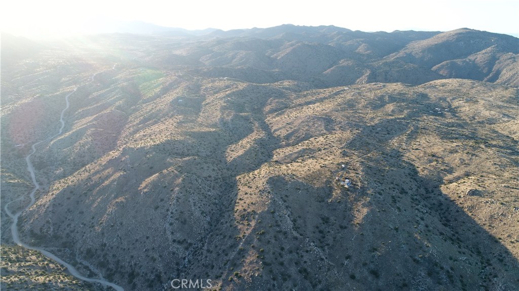 2-ac Burns Canyon Road Pioneertown, CA 92268 - Photo 12 of 14 a view of a dry yard with mountains in the background