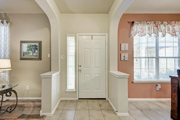 a view of a door and an empty room