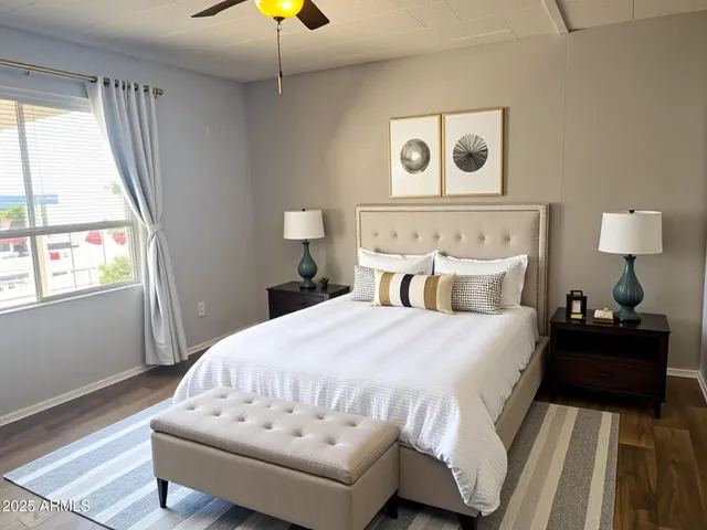 a bedroom with a bed and a chandelier