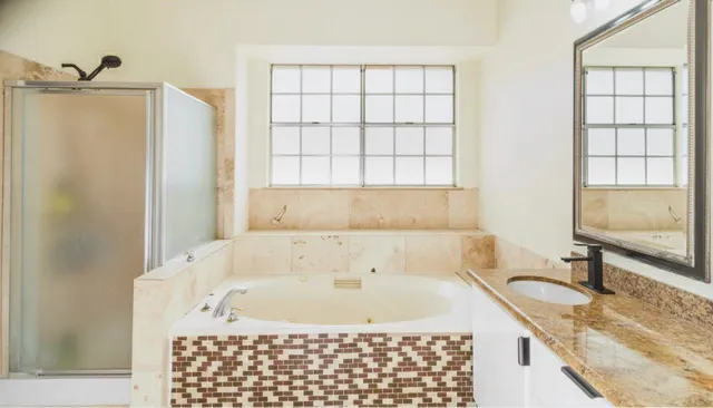 a bath tub sitting next to a window