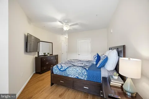 a bedroom with a bed and a tv on table