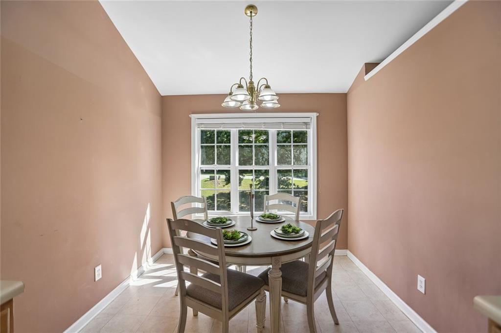 9720 Poole Road Villa Rica, GA 30180 - Photo 9 of 40 a dining room with furniture and window