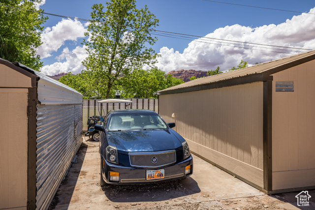 527 Palisade Drive Moab, UT 84532 - Photo 30 of 51 View of parking featuring fence