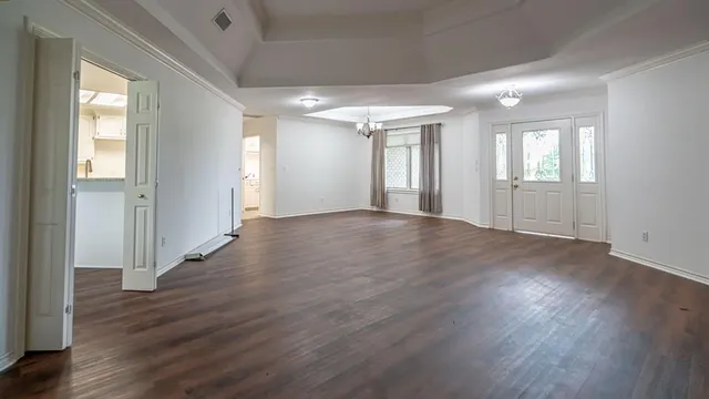 a view of a kitchen with sink and cabinets