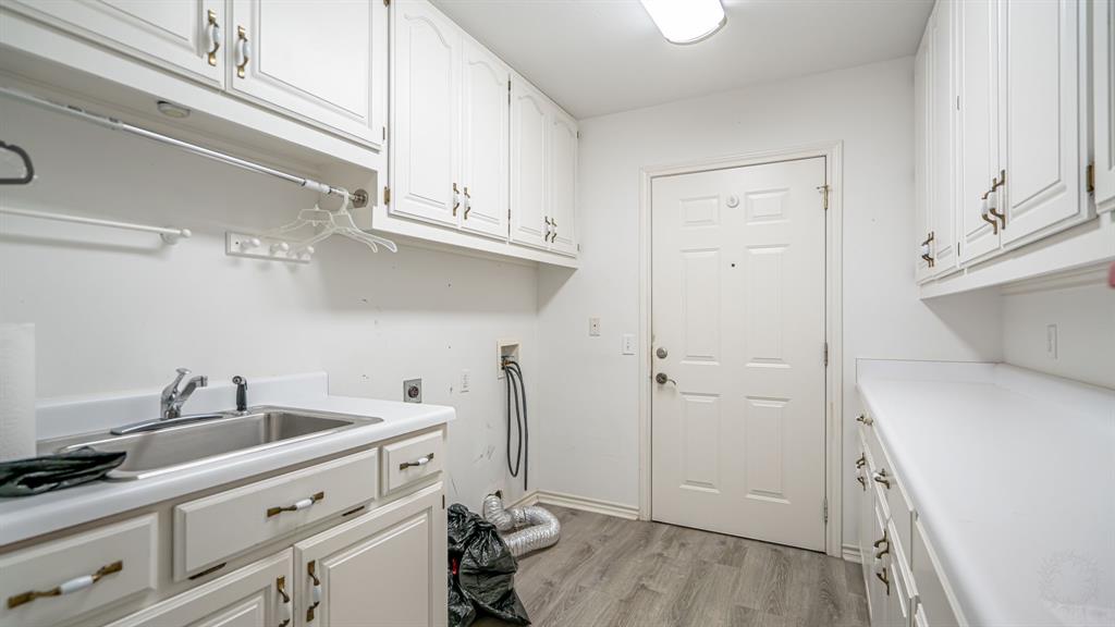 111 Scenic Drive Dublin, TX 76446 - Photo 25 of 40 a view of a kitchen with sink and cabinets