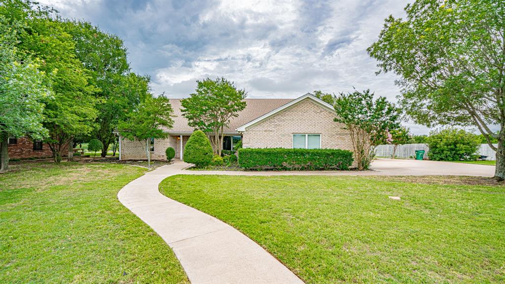 111 Scenic Drive Dublin, TX 76446 - Photo 35 of 40 a front view of a house with garden