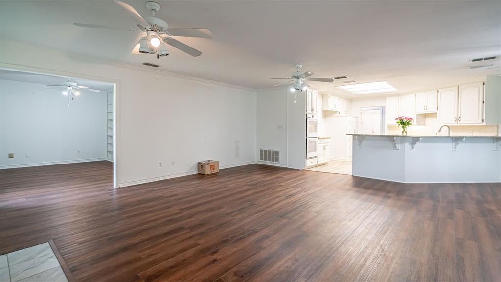 111 Scenic Drive Dublin, TX 76446 - Photo 10 of 40 wooden floor in an empty room with a window