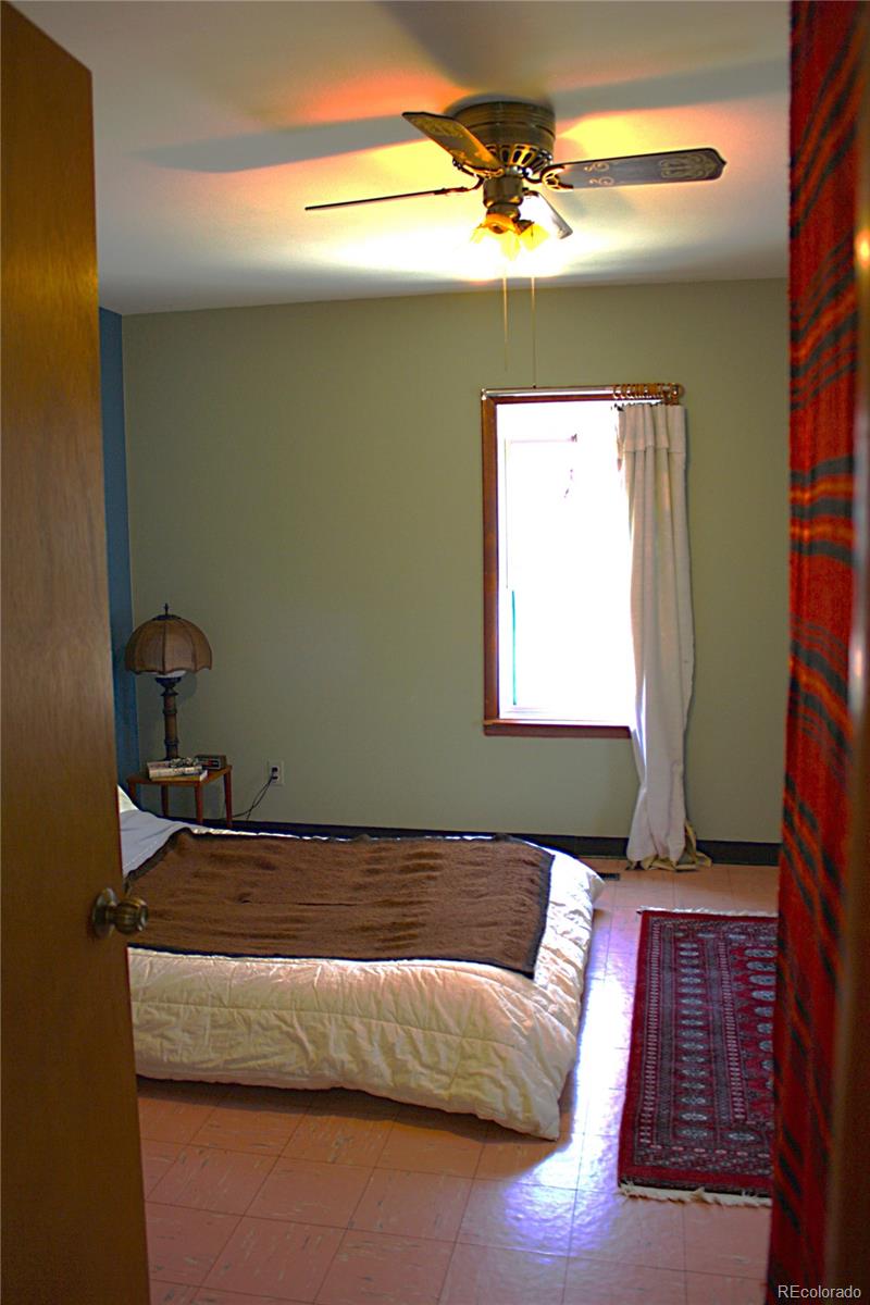 111 Reed Place Longmont, CO 80504 - Photo 4 of 19 a bedroom with a bed and a window