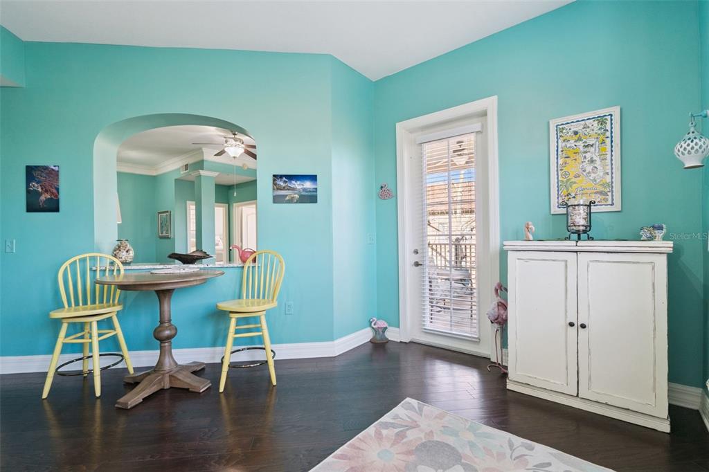515 Mirasol Circle, Unit 302 Celebration, FL 34747 - Photo 12 of 60 a dining room with furniture and wooden floor