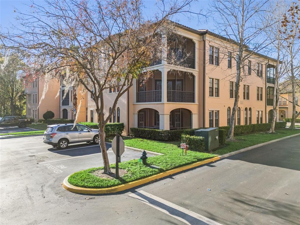 515 Mirasol Circle, Unit 302 Celebration, FL 34747 - Photo 2 of 60 a front view of a house with garden