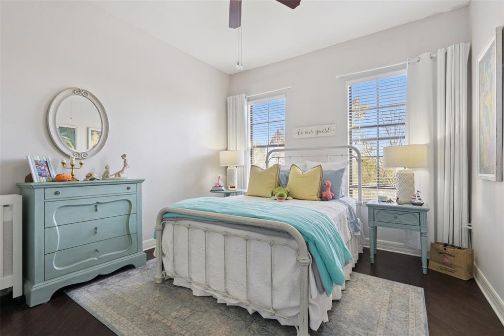 515 Mirasol Circle, Unit 302 Celebration, FL 34747 - Photo 27 of 60 a bedroom with a bed and a dresser