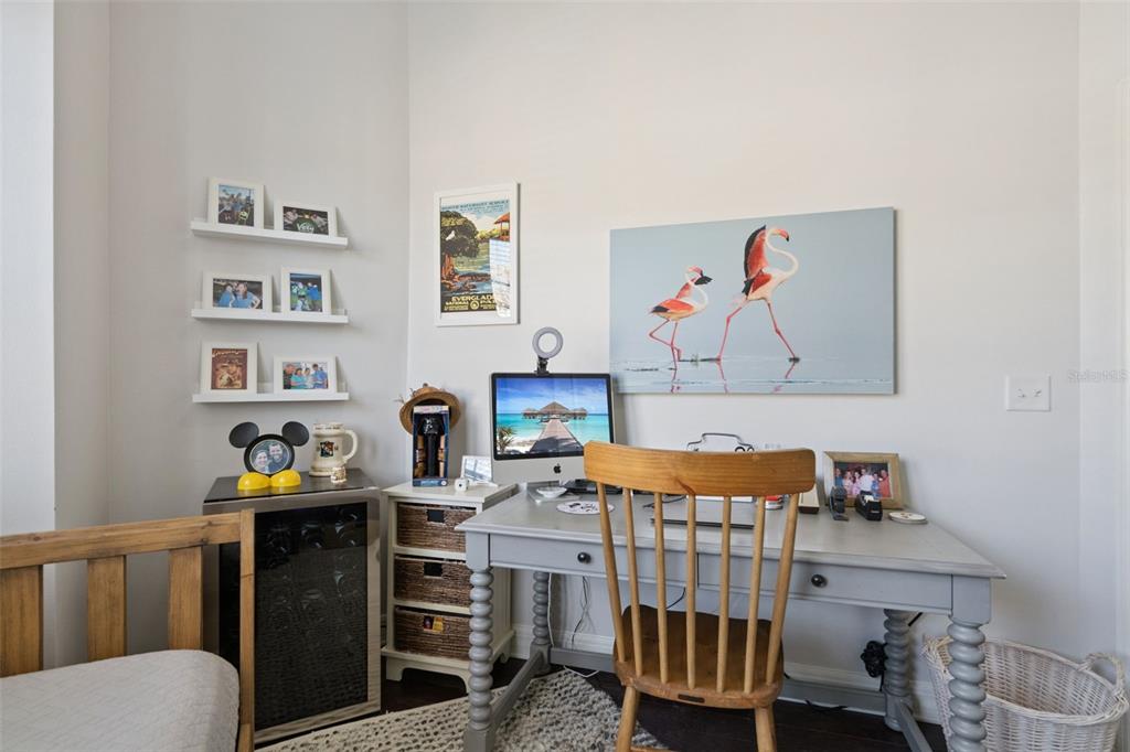 515 Mirasol Circle, Unit 302 Celebration, FL 34747 - Photo 40 of 60 a bedroom with furniture and a couch