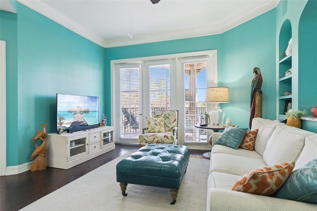 515 Mirasol Circle, Unit 302 Celebration, FL 34747 - Photo 4 of 60 a living room with furniture and a flat screen tv