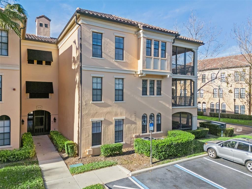 515 Mirasol Circle, Unit 302 Celebration, FL 34747 - Photo 51 of 60 a front view of a house with garden