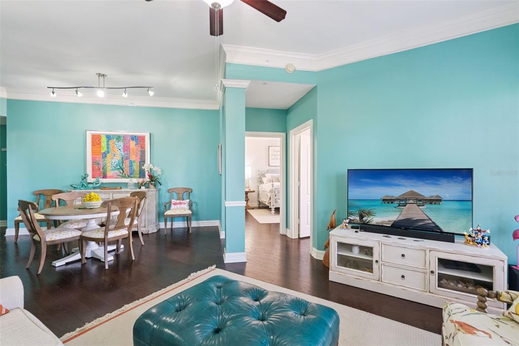 515 Mirasol Circle, Unit 302 Celebration, FL 34747 - Photo 6 of 60 a living room with furniture and a flat screen tv