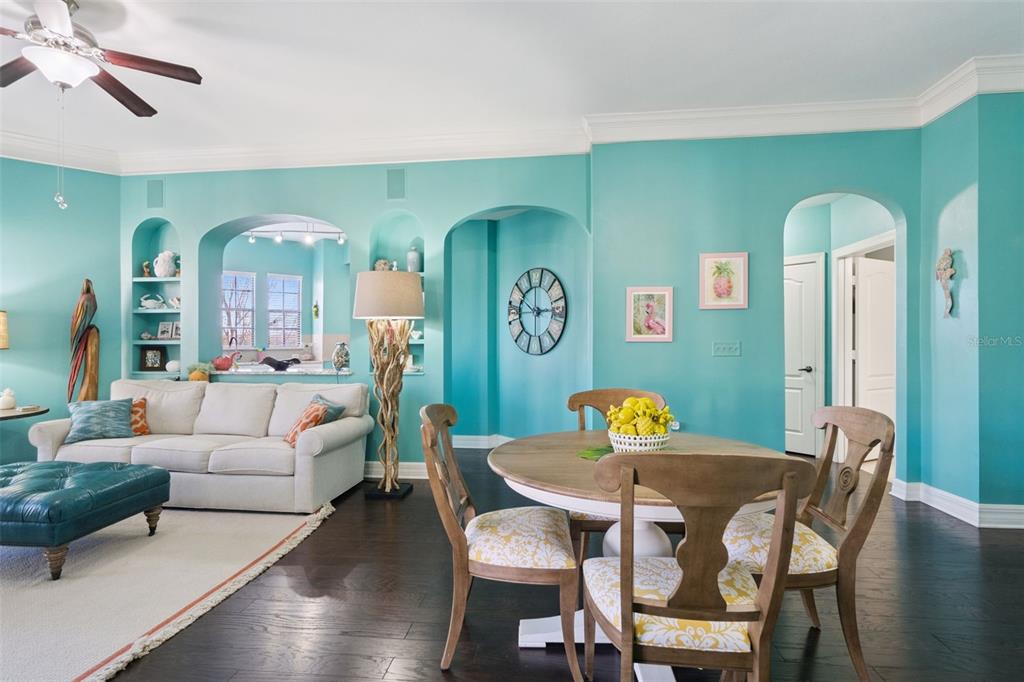 515 Mirasol Circle, Unit 302 Celebration, FL 34747 - Photo 7 of 60 a living room with furniture and wooden floor