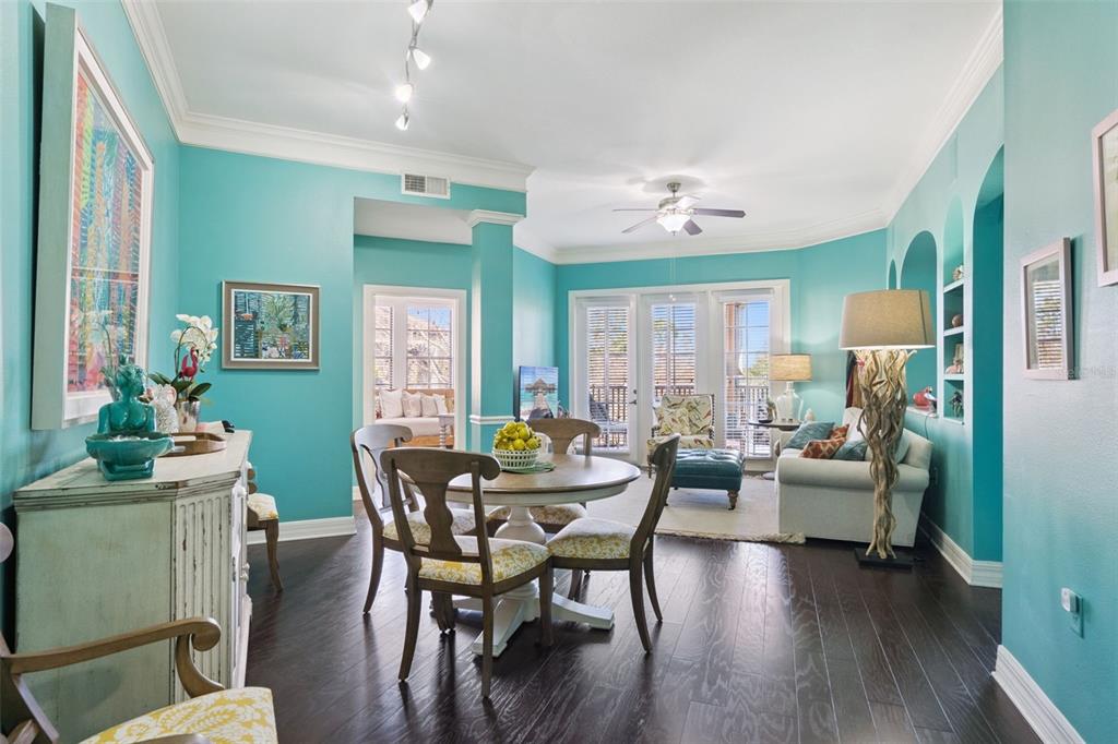515 Mirasol Circle, Unit 302 Celebration, FL 34747 - Photo 8 of 60 a view of a dining room with furniture window and wooden floor
