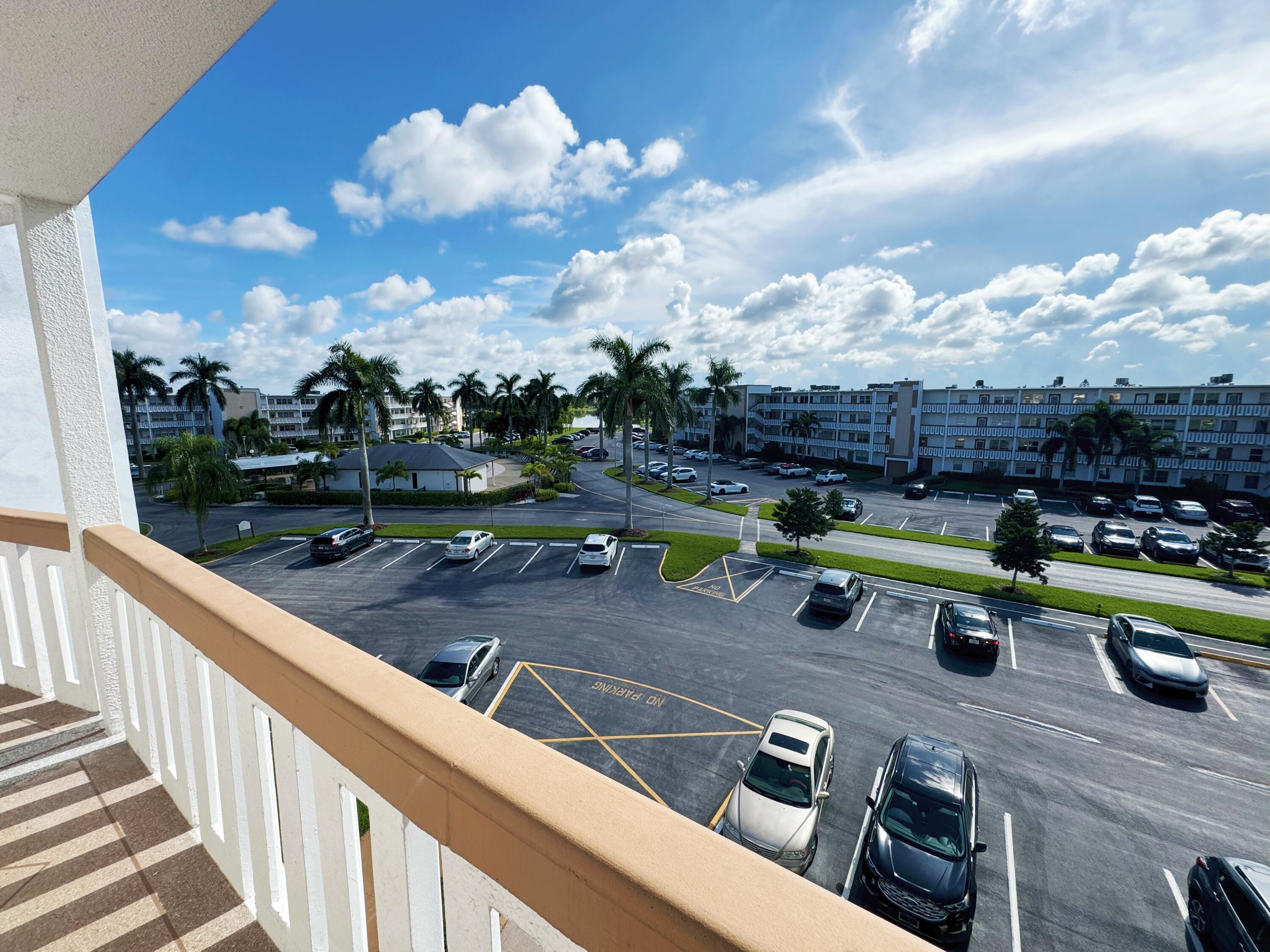 4075 Cornwall East Boca Raton, FL 33434 - Photo 2 of 30 a view of a swimming pool with a patio