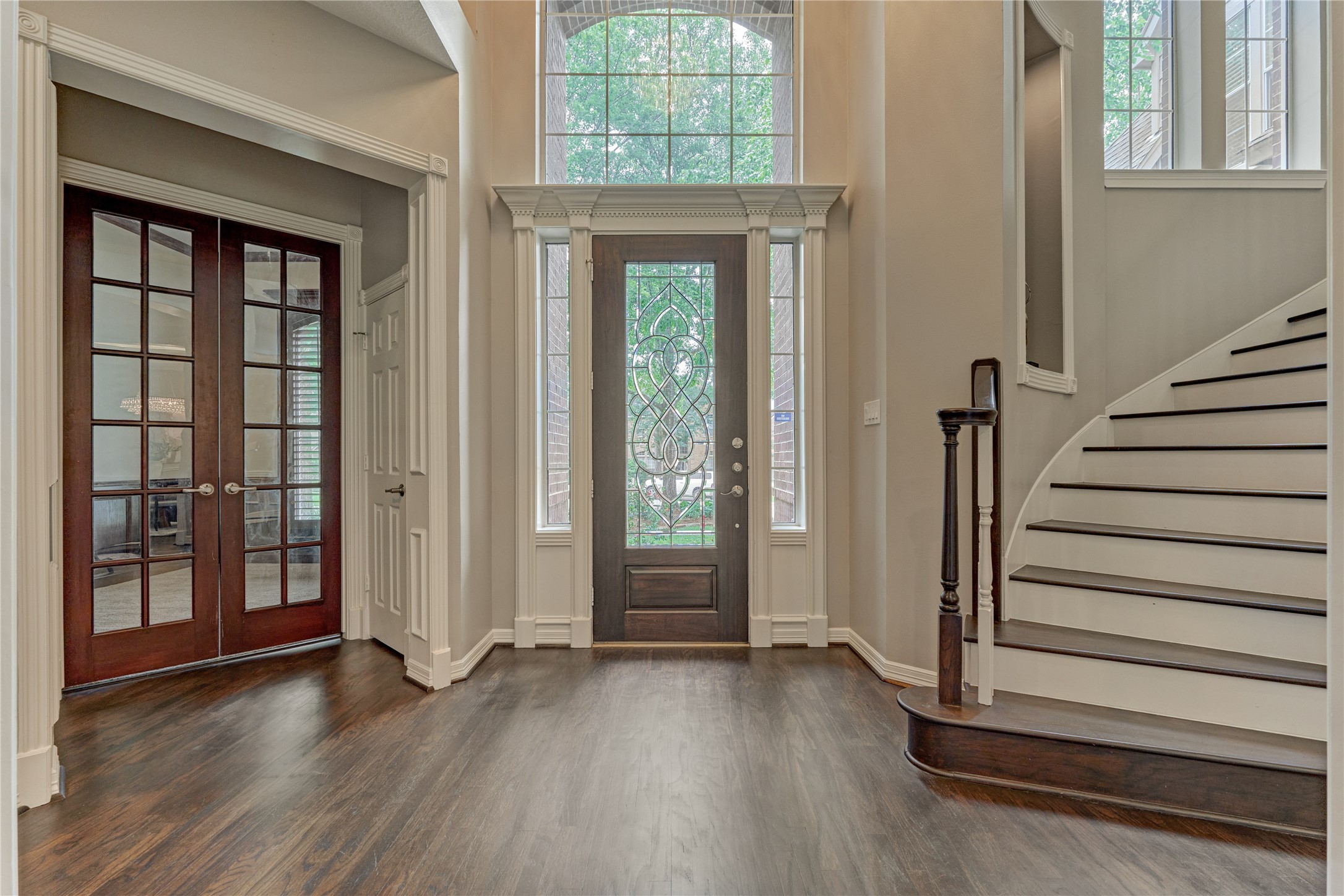 7 Gentry Oak Court Spring, TX 77381 - Photo 7 of 50 a view of entryway with wooden floor and windows