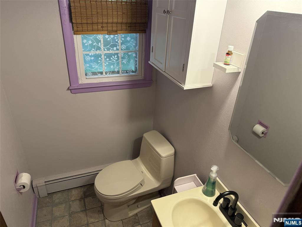 36 Lavina Trail Oak Ridge, NJ 07438 - Photo 16 of 26 a white toilet sitting next to a window and a sink