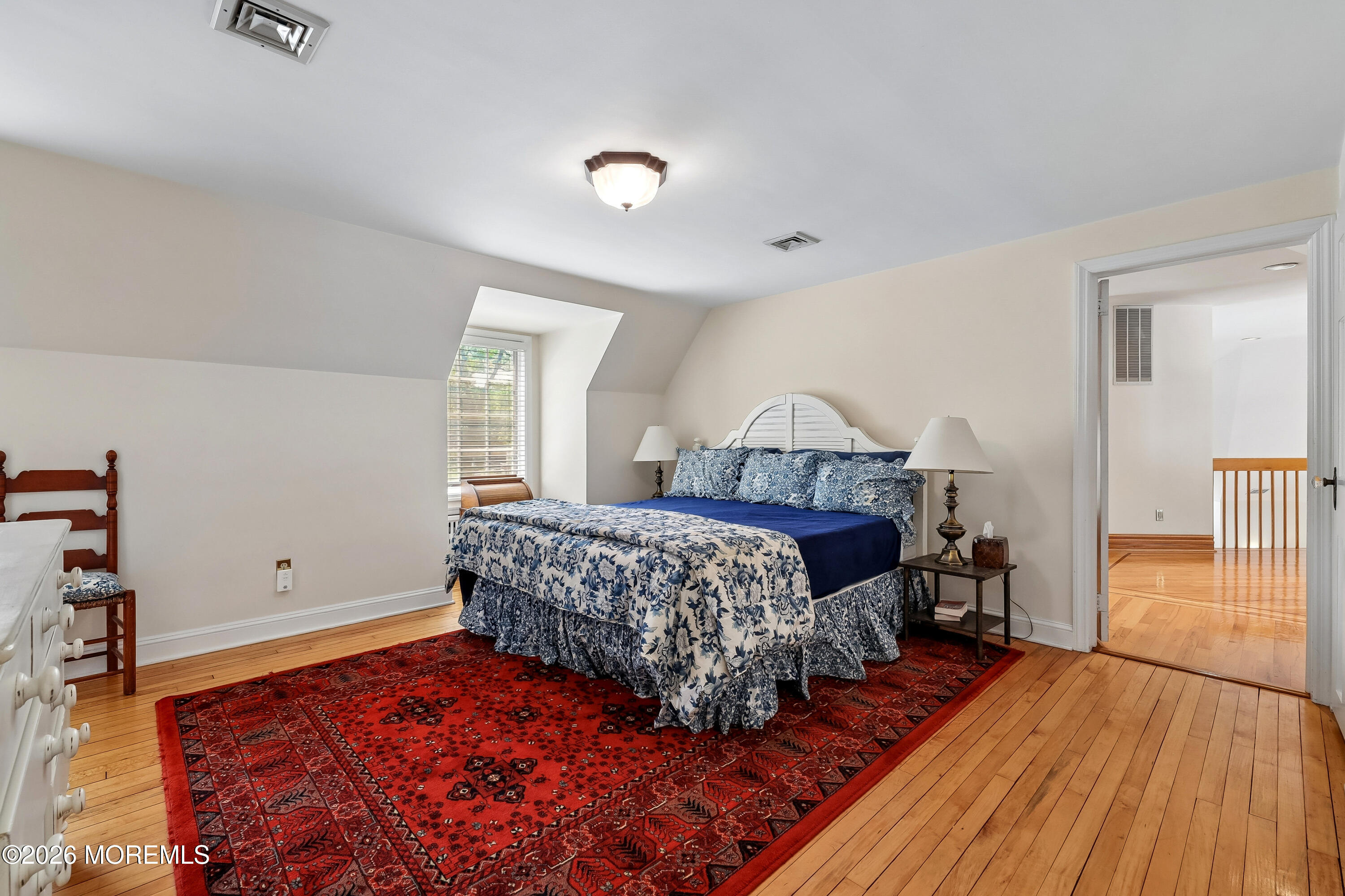 187 Hockhockson Road Colts Neck, NJ 07722 - Photo 41 of 55 a bedroom with a bed and wooden floor