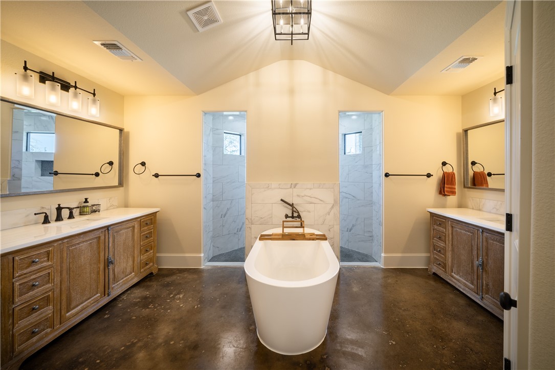 315 Bluestem Cove Georgetown, TX 78633 - Photo 12 of 35 a bathroom with a sink a washer and dryer