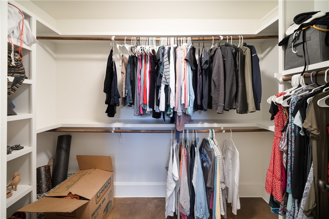 315 Bluestem Cove Georgetown, TX 78633 - Photo 17 of 35 a view of walk in closet with clothes and shoes