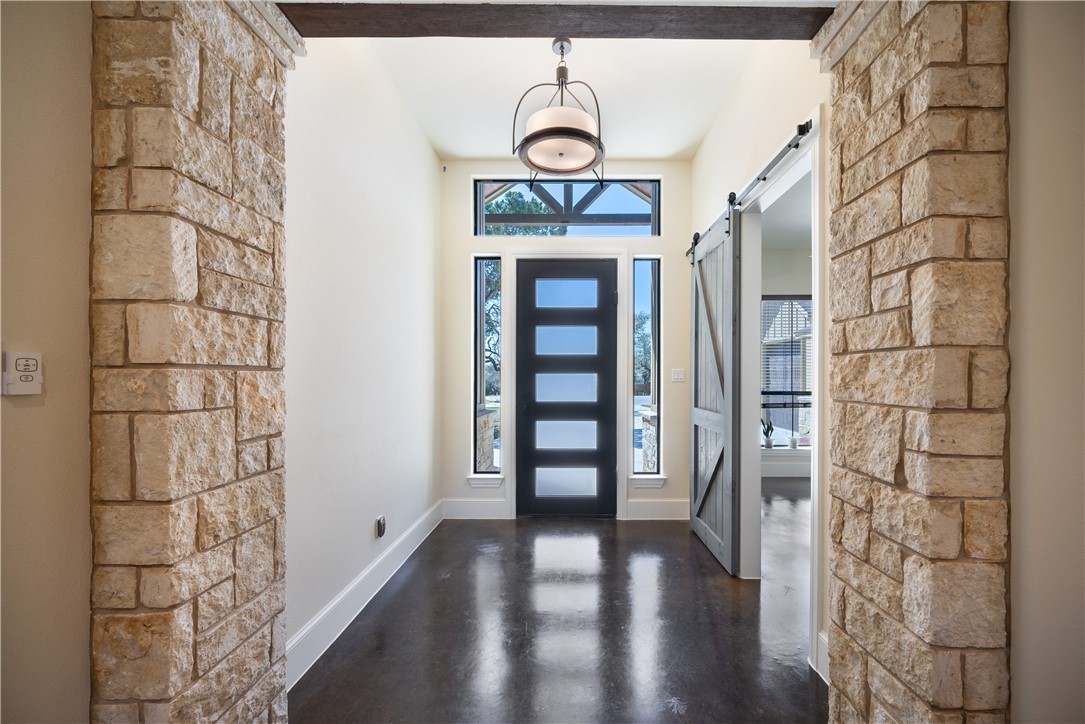 315 Bluestem Cove Georgetown, TX 78633 - Photo 18 of 35 a view of a hallway with wooden floor and workspace