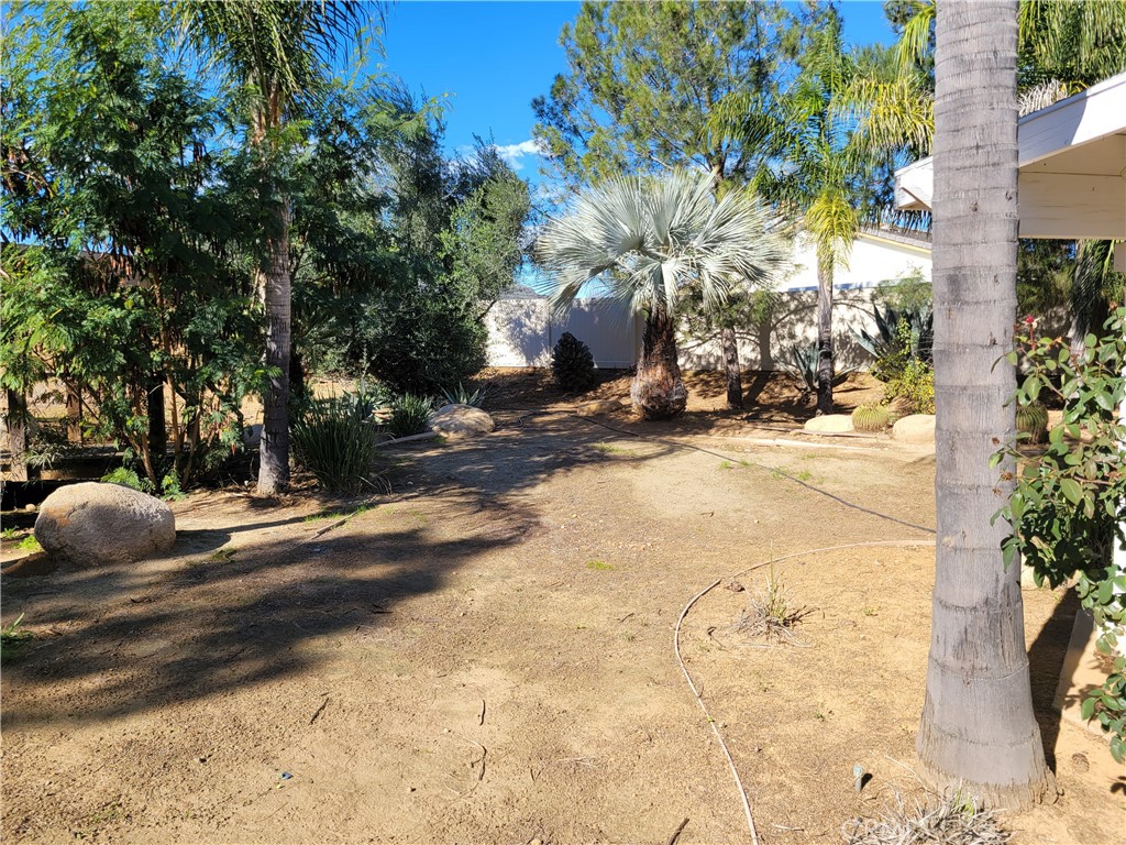 25540 Turfwood Street Menifee, CA 92585 - Photo 11 of 27 a view of a street with a building in the background