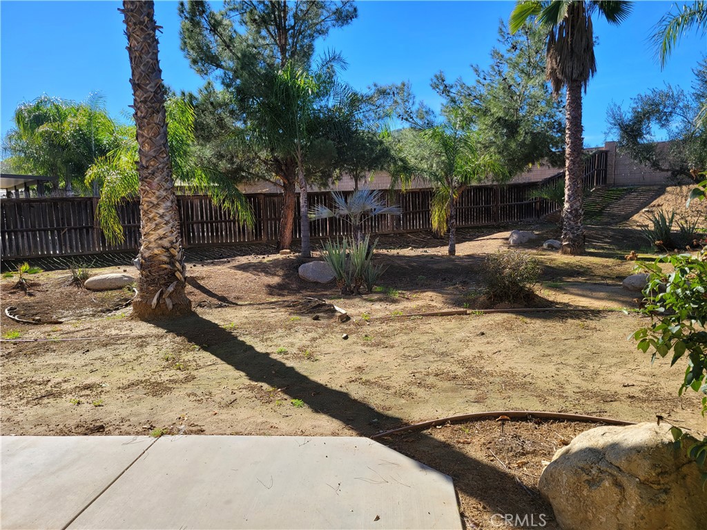 25540 Turfwood Street Menifee, CA 92585 - Photo 14 of 27 a view of a backyard of the house