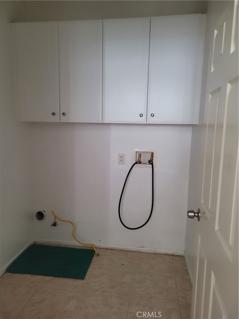 25540 Turfwood Street Menifee, CA 92585 - Photo 16 of 27 a bathroom with a sink and cabinets
