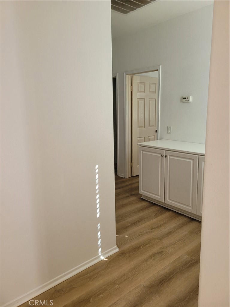 25540 Turfwood Street Menifee, CA 92585 - Photo 21 of 27 a view of empty room with wooden floor