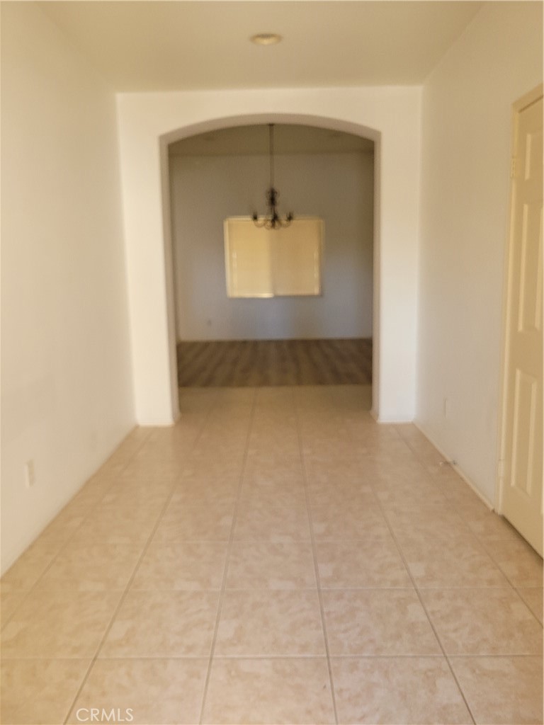 25540 Turfwood Street Menifee, CA 92585 - Photo 8 of 27 a view of an empty room with a window